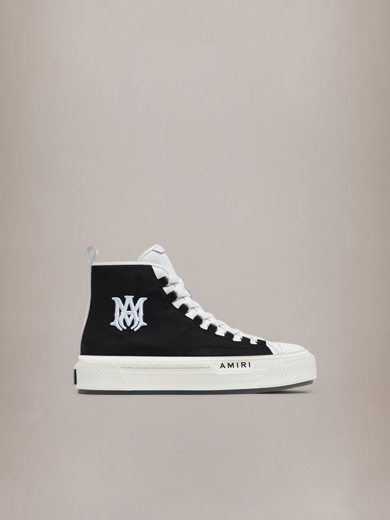 Black and white high-top canvas sneaker with white laces, AM logo on tongue, and AMIRI branding on sole.