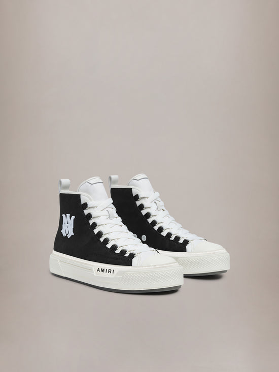 Black and white high-top sneakers with white laces, white toe cap, and 