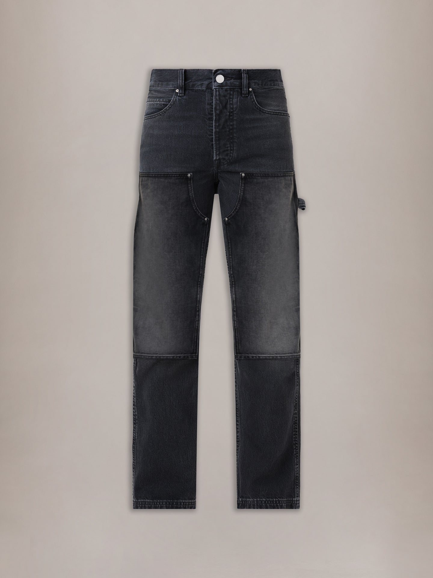 Vintage black carpenter jeans with contrasting panel sections, utility pockets, and white top button.