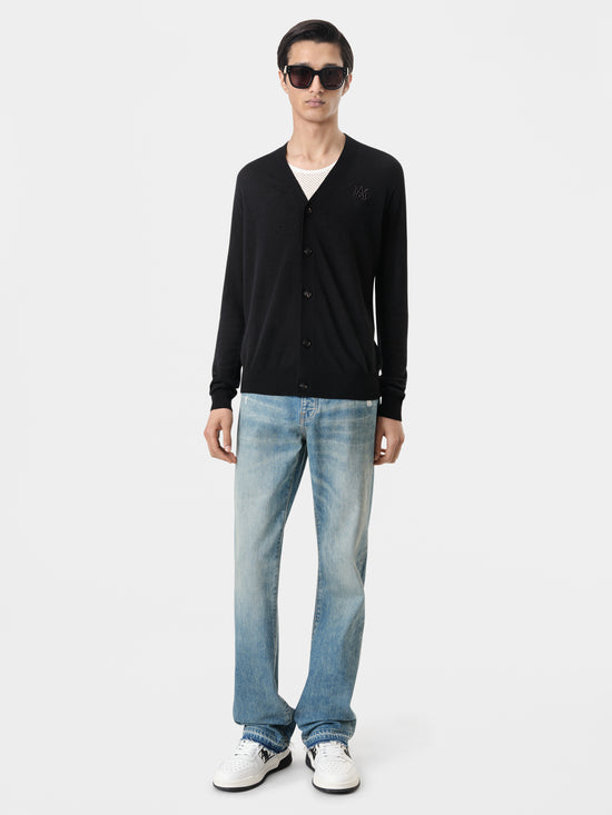 AMIRI Released Hem Straight Jean in Crafted Indigo with MA Cardigan in Black with Classic Low Sneakers in Black White and Classic MA Sunglasses in Black