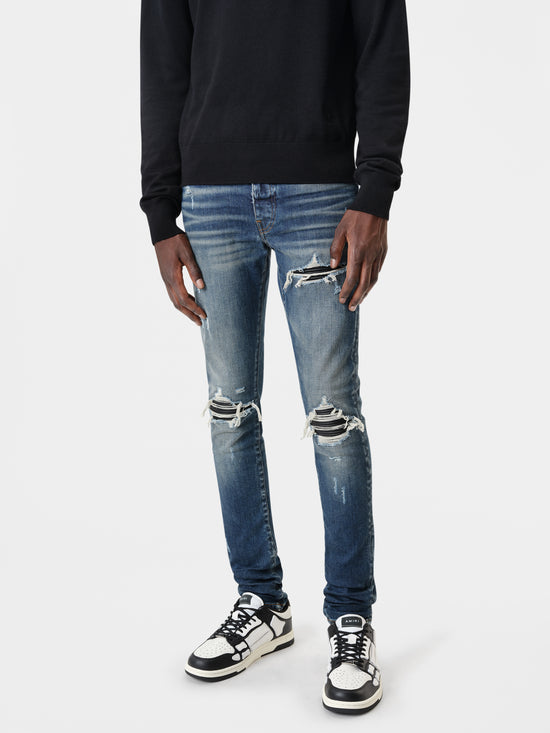 AMIRI MX1 Jean in Deep Classic Indigo with MA Long Sleeve Black Shirt and Black White Skel Top Low Sneakers