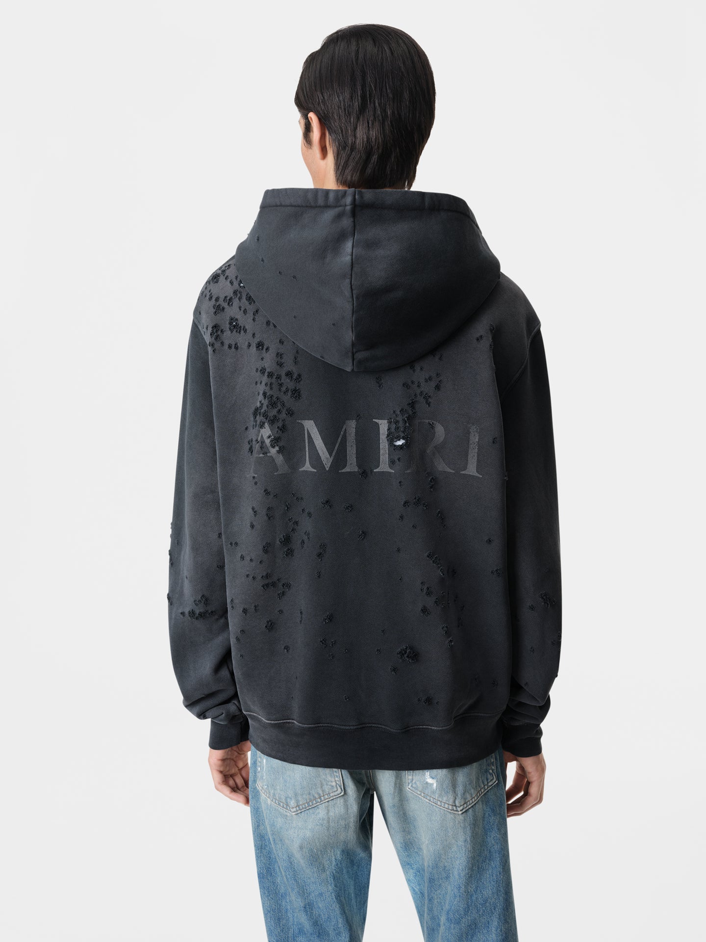 AMIRI MA Shotgun Zip Up Hoodie in Faded Black with Released Hem Straight Jean in Antique Indigo and White Black Classic Low Sneakers