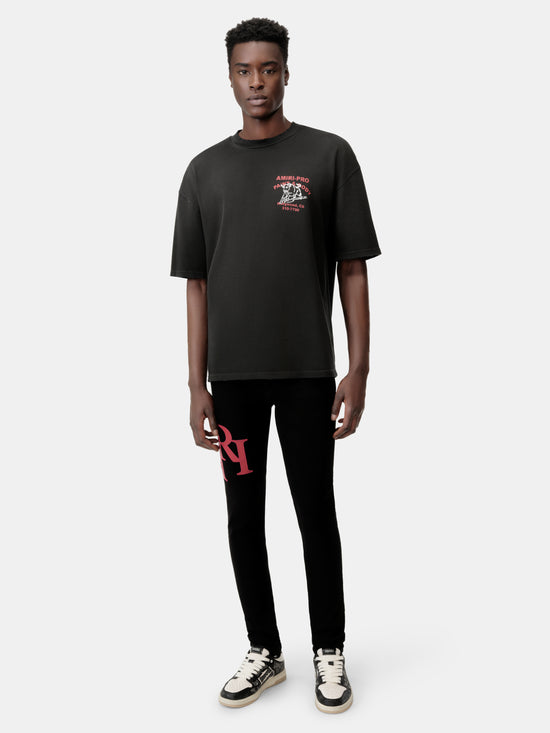 STAGGERED LOGO SKINNY JEAN- Black Red - AMIRI